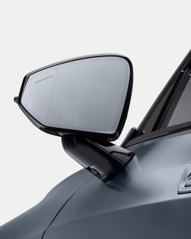 Frameless rear-view mirror of a blue Polestar 1