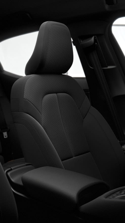 Dark textile sets inside the Polestar 2. Dark interior.