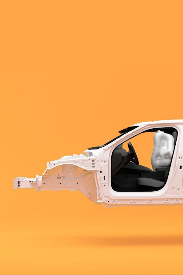 Orange background and white frame of the Polestar 2. Airbags deployed