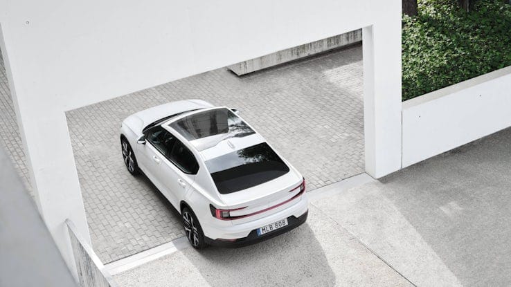 White Polestar 2 with concrete background.