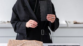 Close-up of Maria Uggla holding the Polestar signature weave.