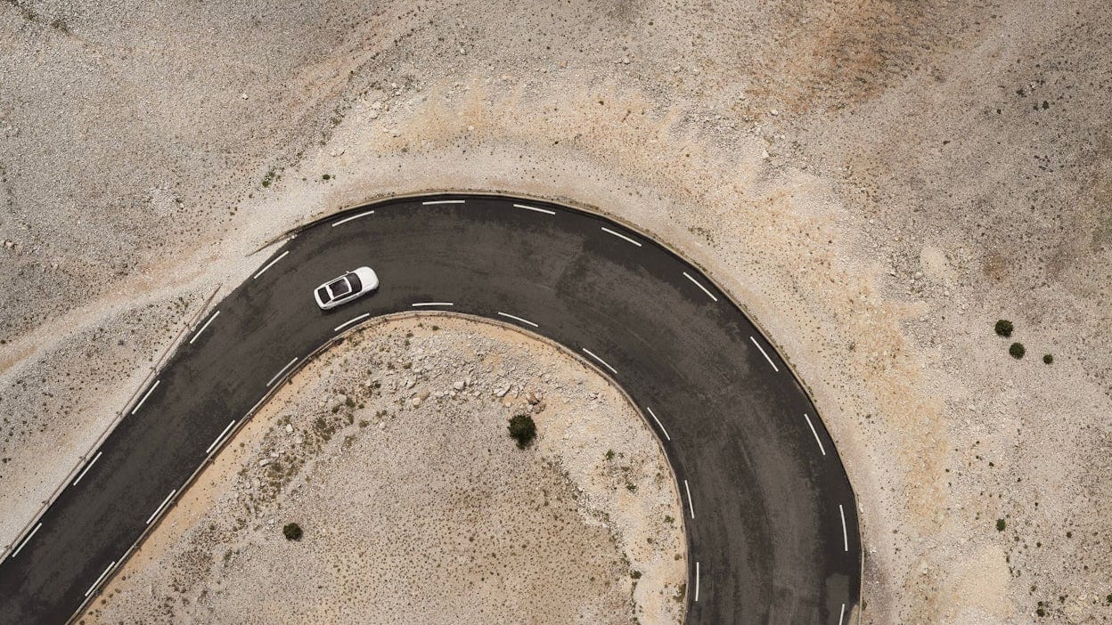 Arial view of Polestar taking tight corner