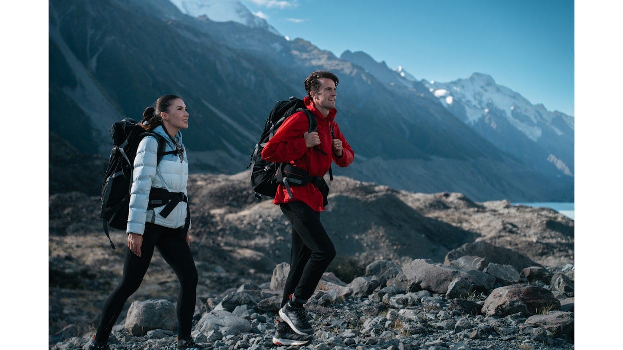 Cam and Lana hiking up a mountain