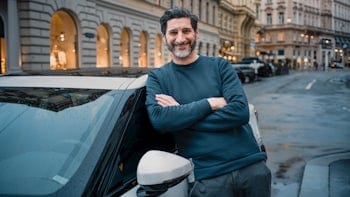 Paul Ivic leaning on his Polestar 2